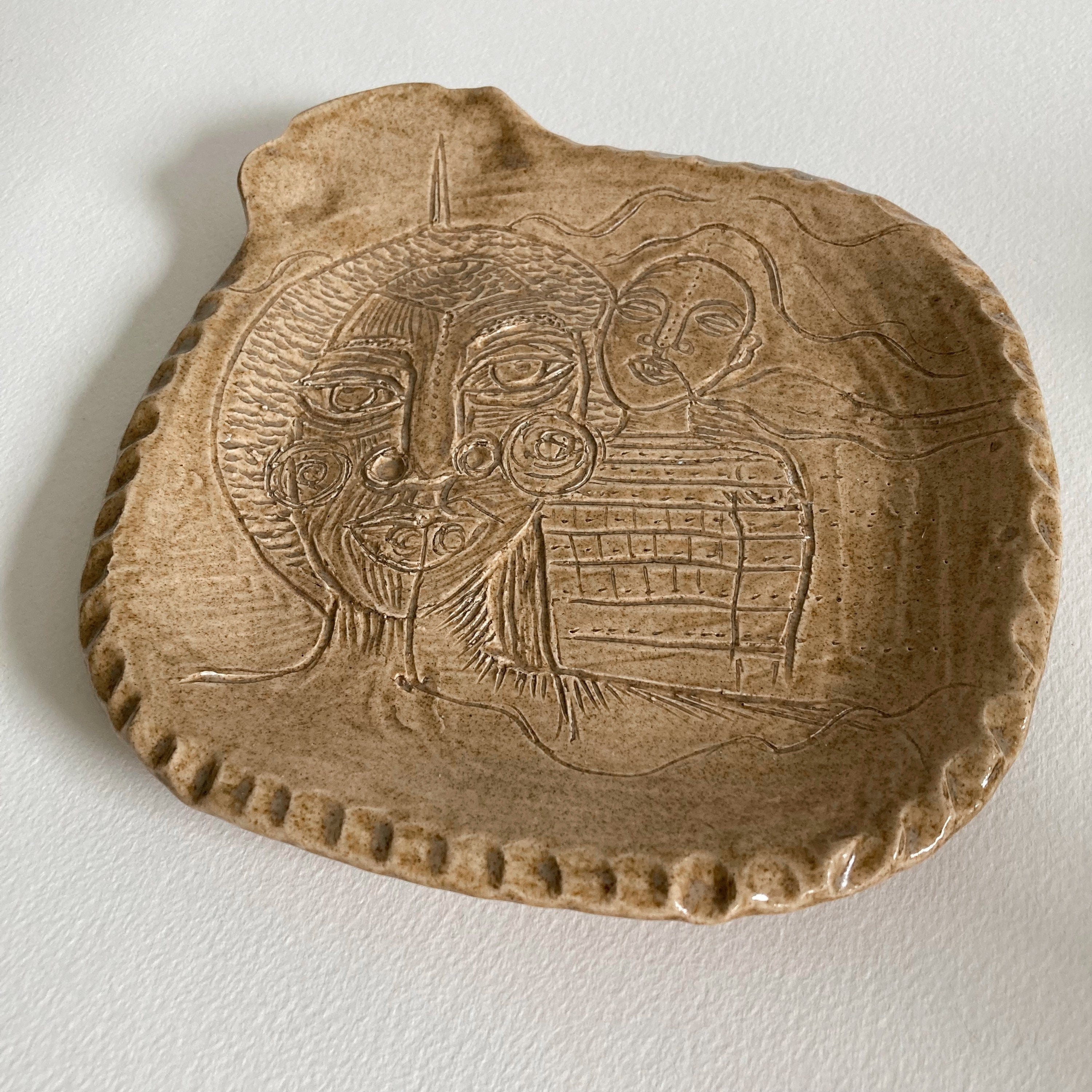 Artist Made Pottery Plate: Tribal Faces, Speckled Tan Glaze, Signed